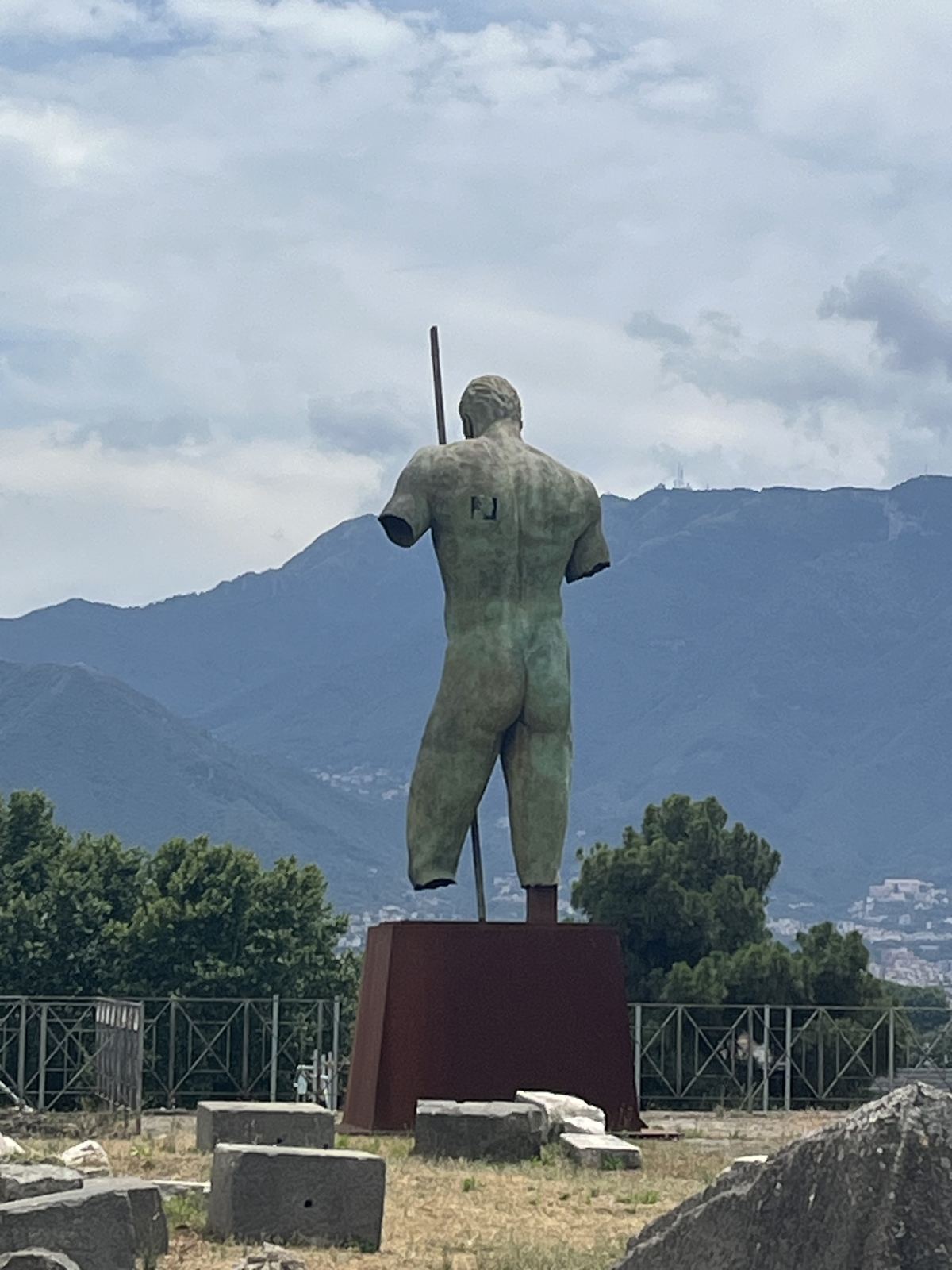 Statue overlooking the ruins of Pompeii